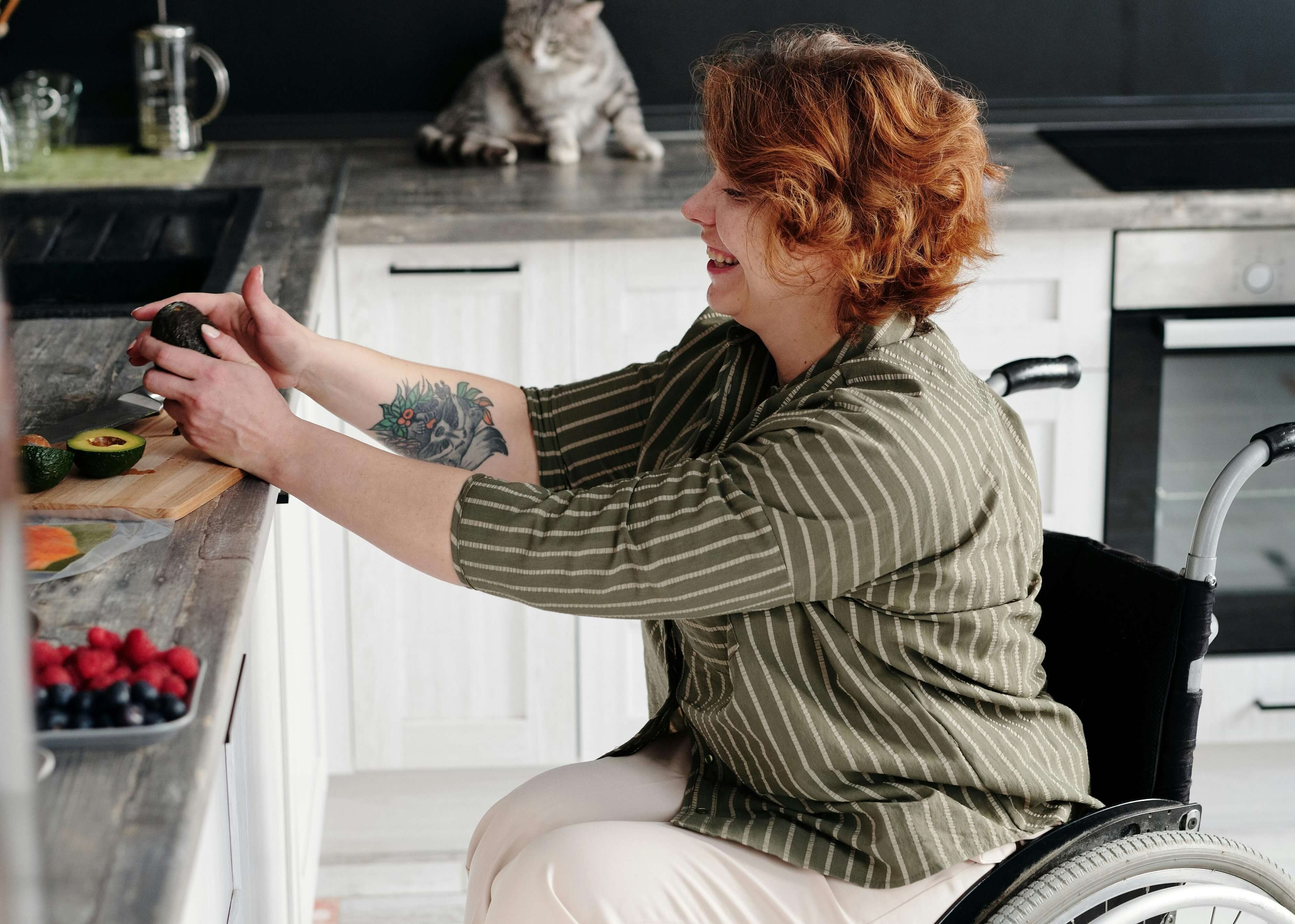 Woman in wheelchair cooking